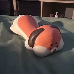 Orange and White Dog wrist rest for mouse.